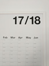 A minimalistic wall calendar displaying months from February to June with bold, black numbers '17/18' at the top.