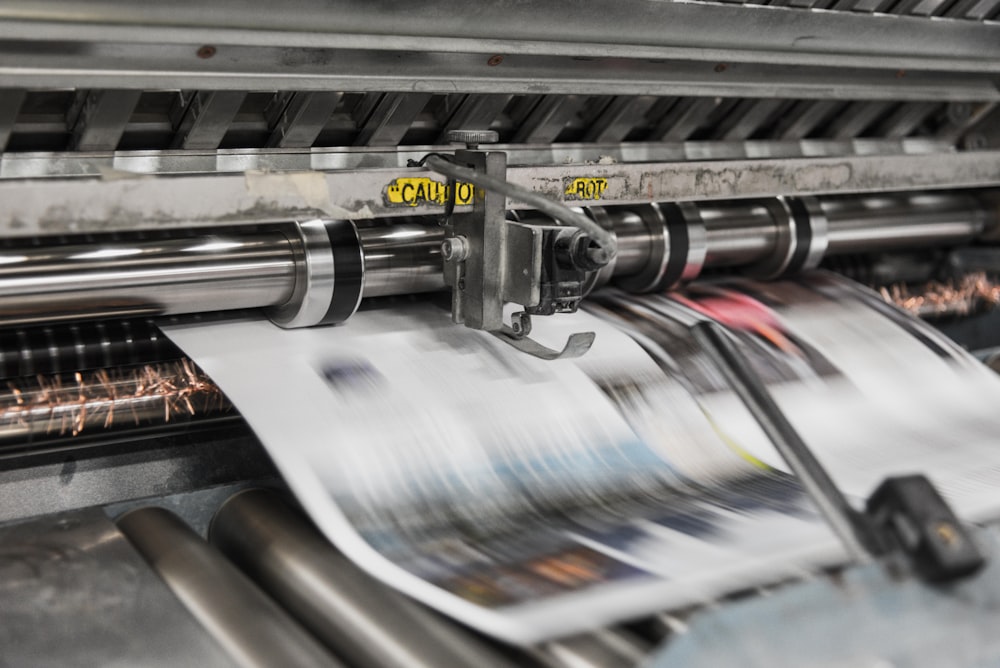 printing machine churning out newspapers