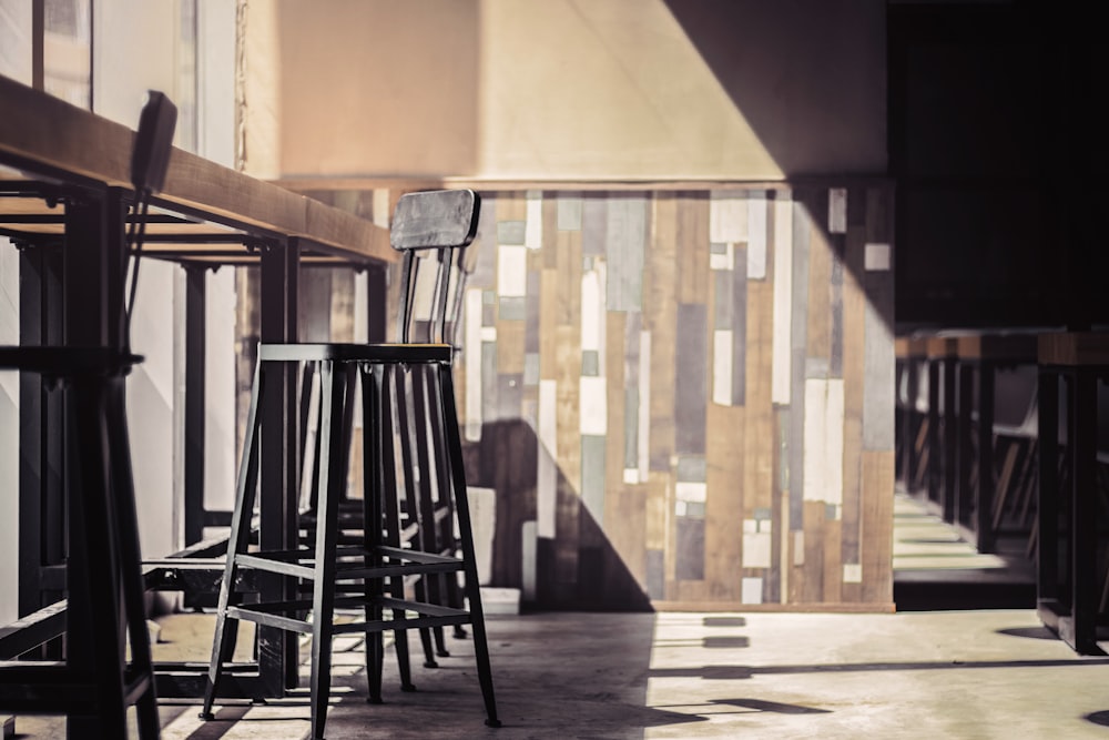 brown wooden stool in front of table