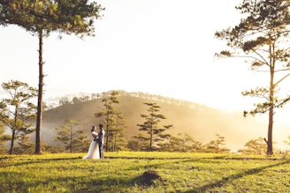 A luxurious outdoor portrait showcasing a couple in a serene setting.