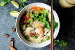 brown chopsticks on white bowl