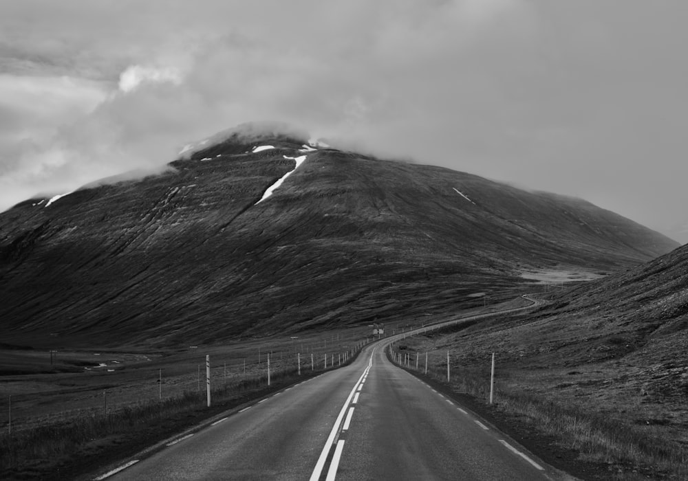 grayscale photo of road and mountain