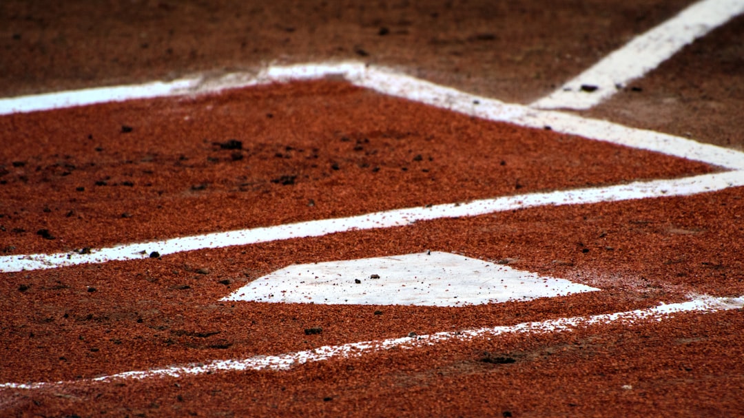 a baseball field with a white line on it, Home Plate