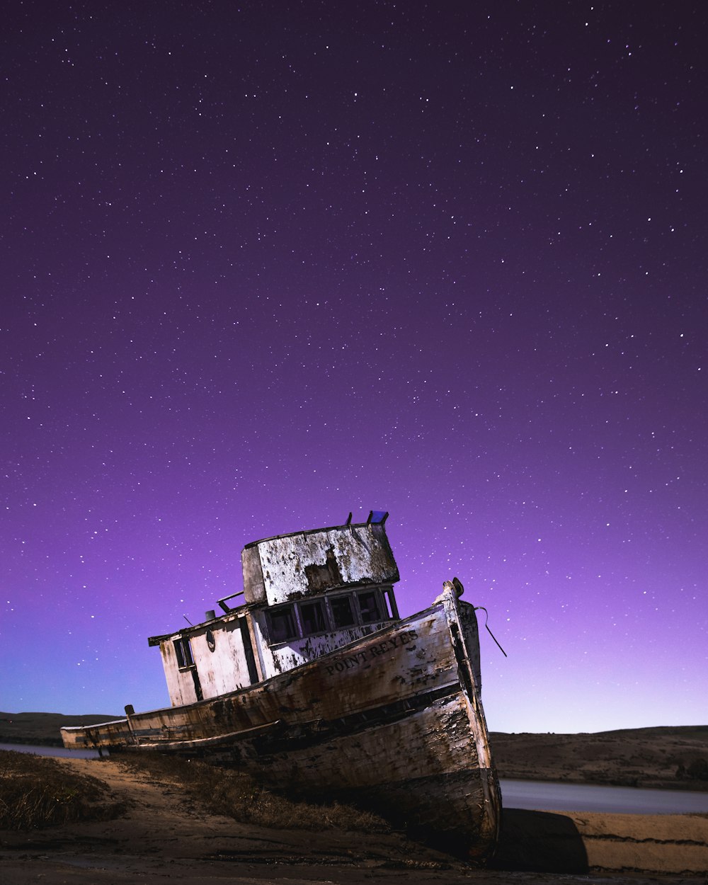 shipwreck under starry night sky
