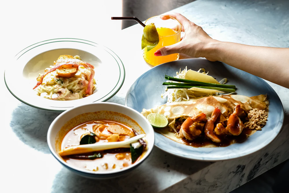 Spread of assorted Thai dishes on a table
