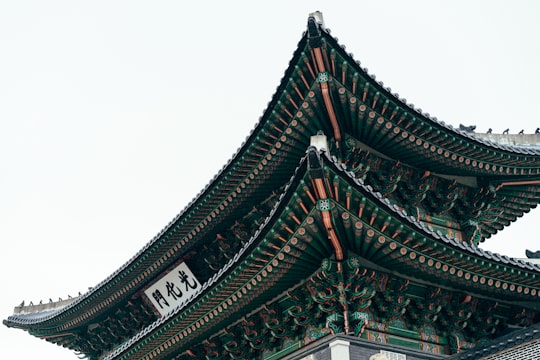 photo of green and gray tori gate in Gwanghwamun Gate South Korea