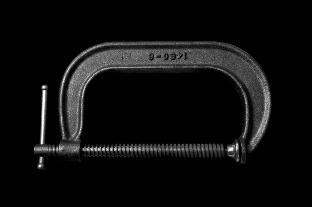 gray pipe cutter against black background