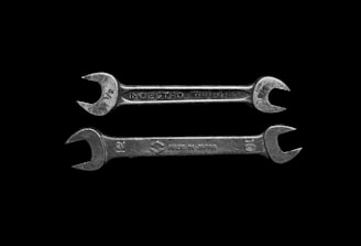 two gray wrenches
