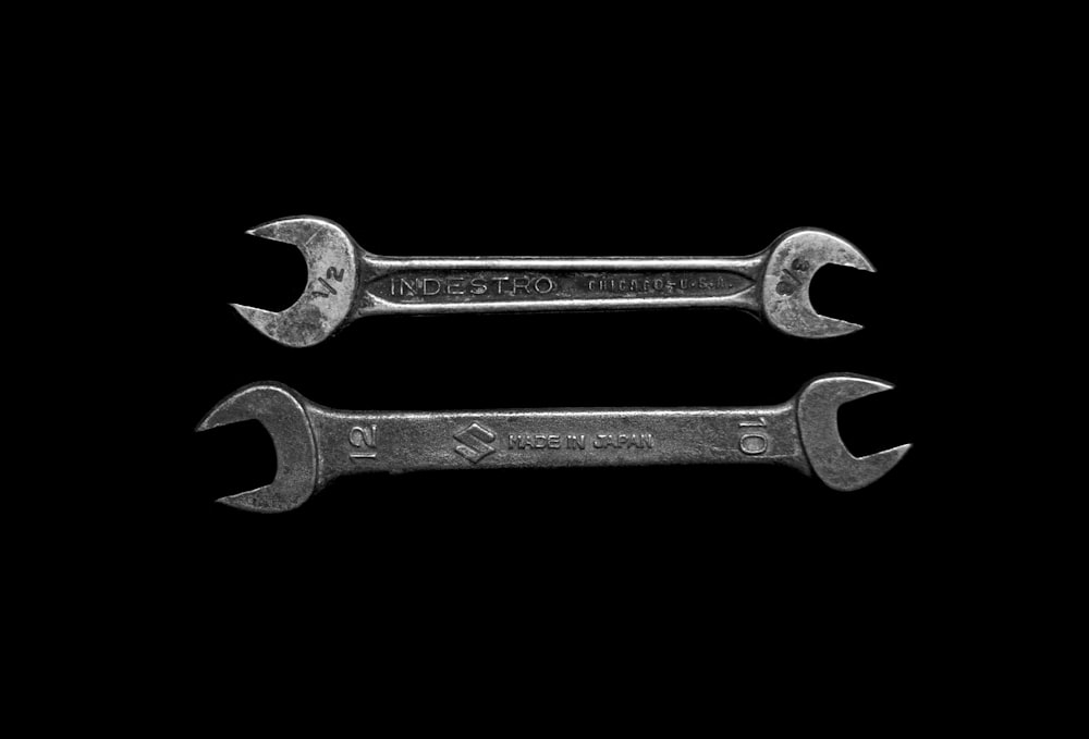 two gray wrenches