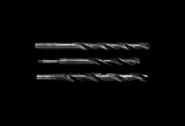 grayscale photo of drill bits