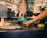 person holding screwdriver