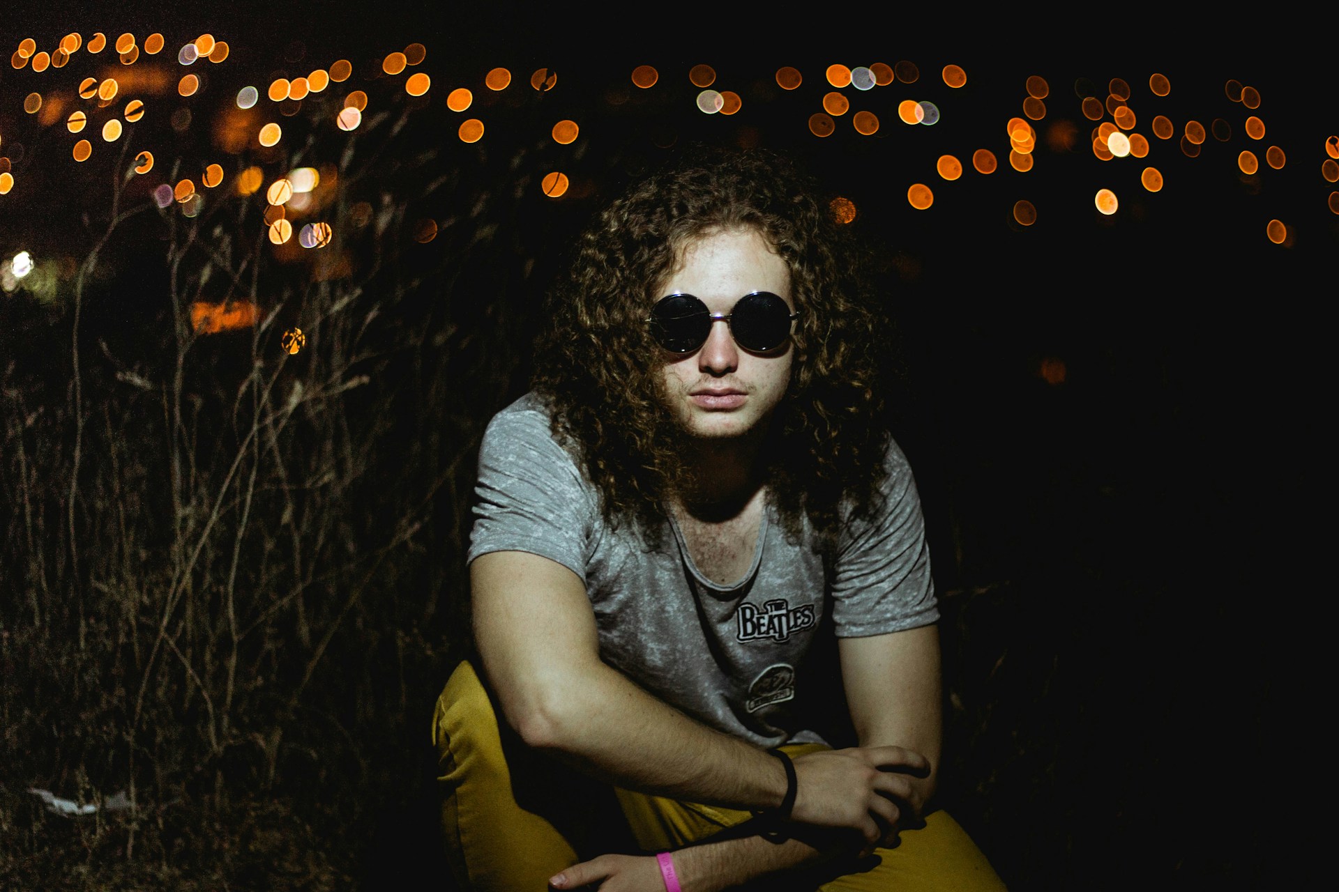 woman wearing yellow long-sleeved dress under white clouds and blue sky during daytime