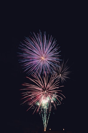 purple and red fireworks time lapse photography