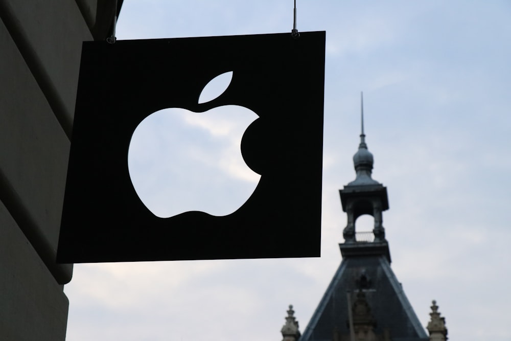 Apple logo in front of a building