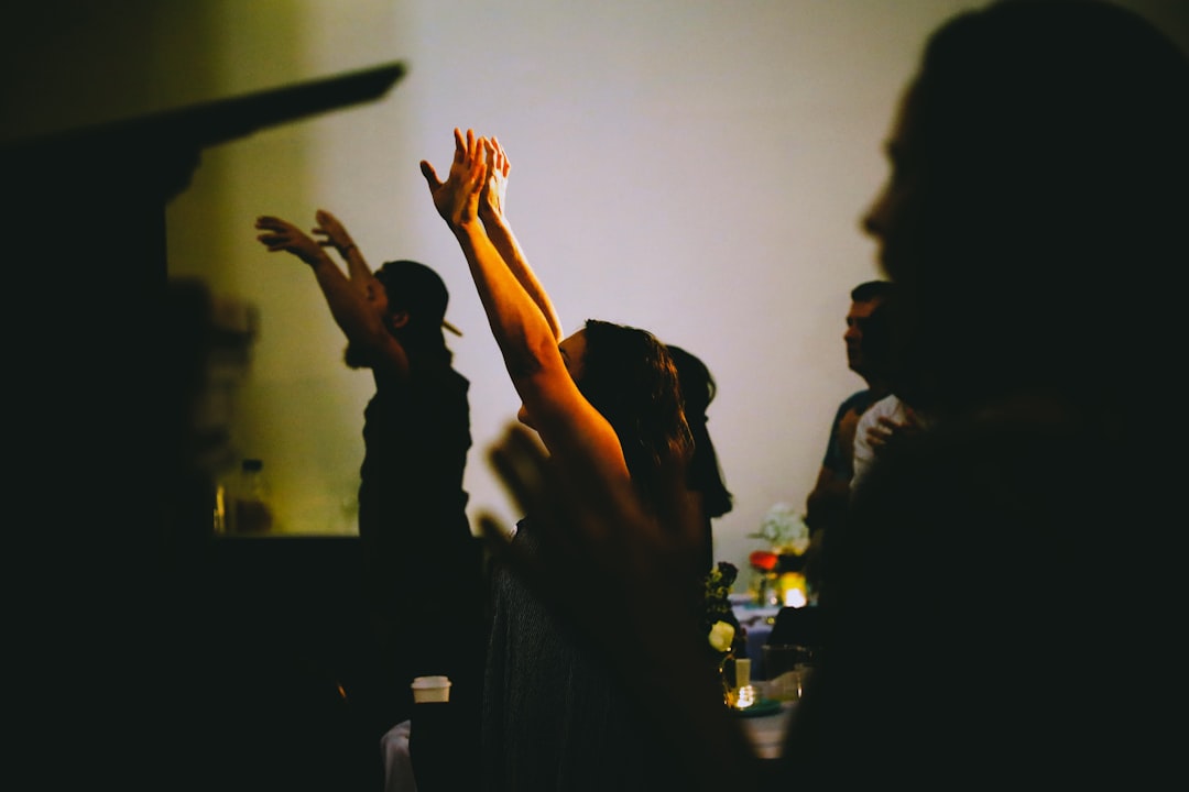 people raising their hands