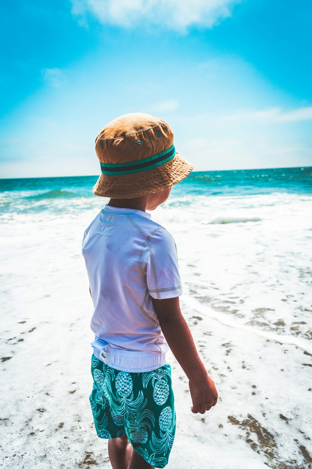 boy wearing brown hat