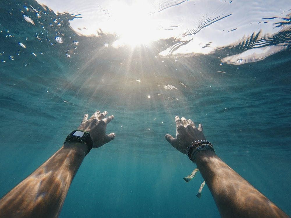 person swimming in sea