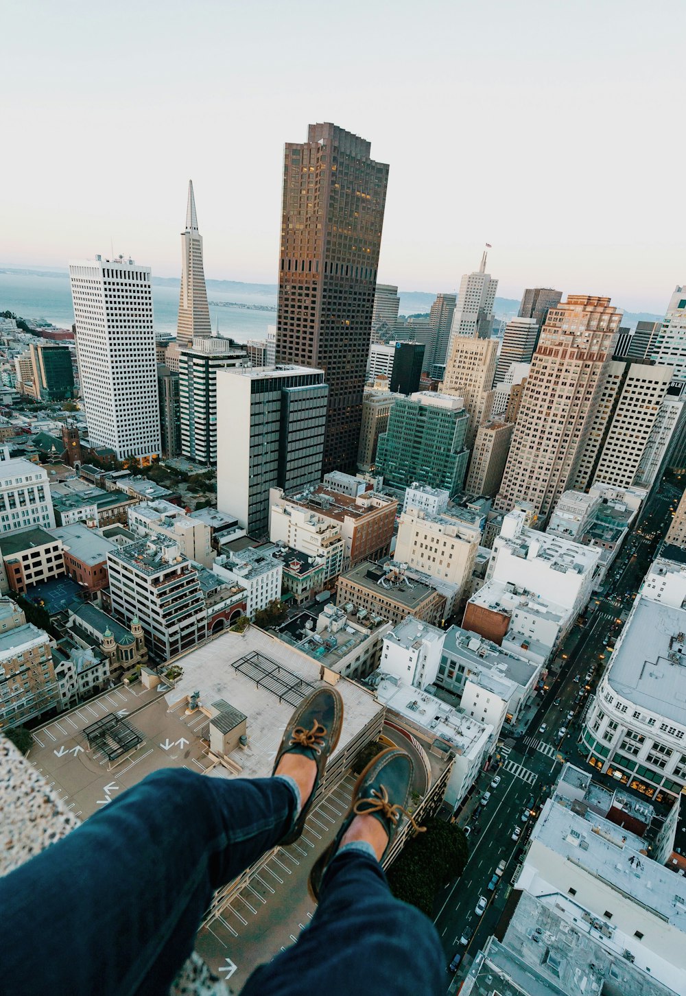 person sitting on rooftop of building