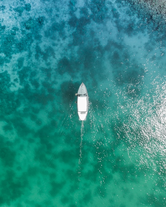 bird's eye view photo of white boat on body of water during daytime in Keyodhoo Maldives