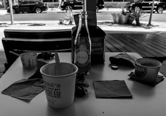 Photo of various disposable packaging products for horeca businesses on a wooden table.