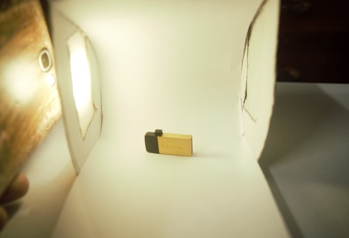 A smiling customer receiving their thumb drive.