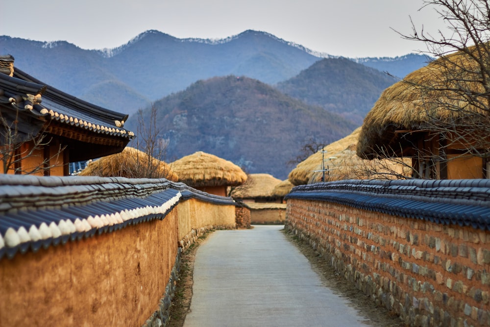 brown wooden houses surrounded by mountains