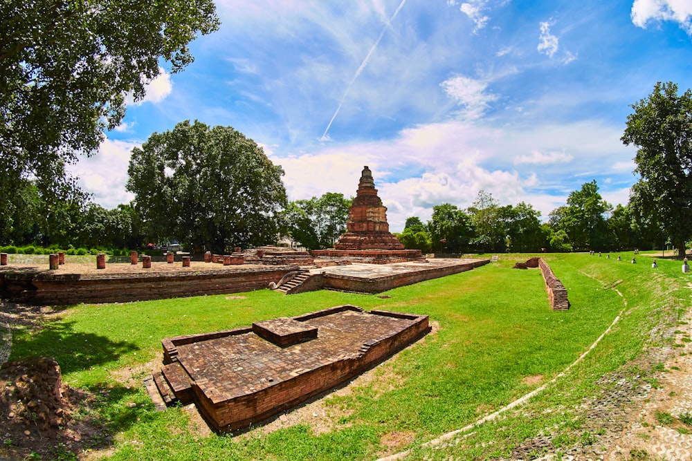 panoramic photography of brown cone shaped building surrounded by trees