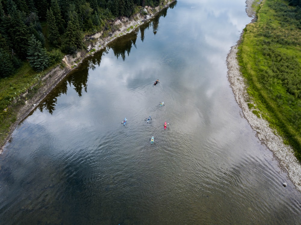 people on boat in the lake