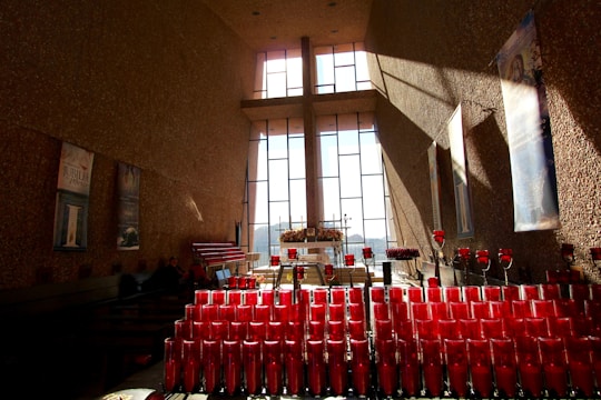 Cozy pop-up exhibition space filled with contemporary Christian art pieces and soft lighting.