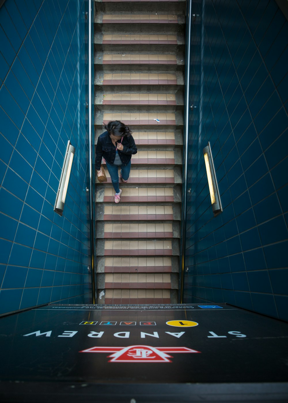 woman walking down St Andrew stairs