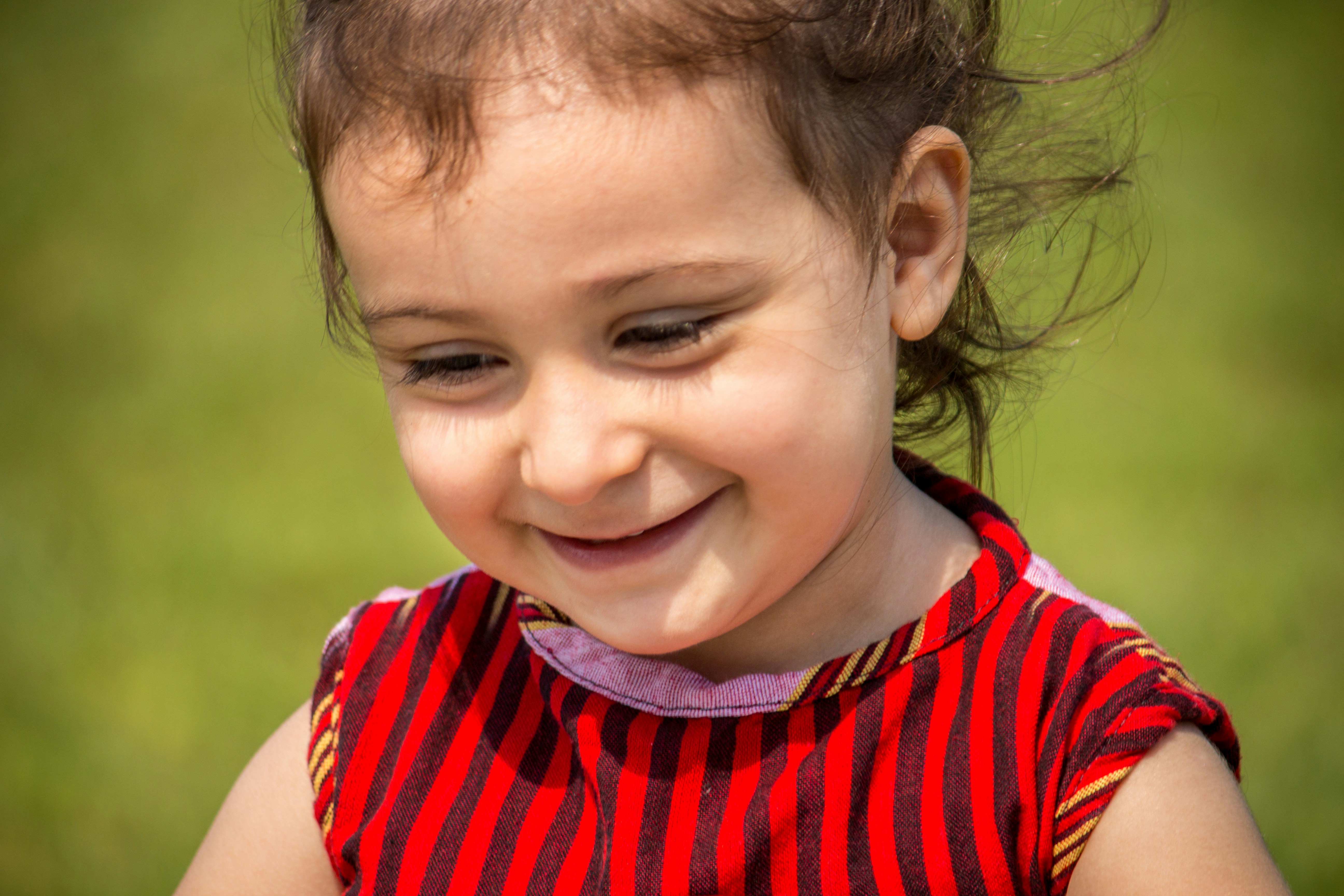 Colourful striped kids t-shirt on white background