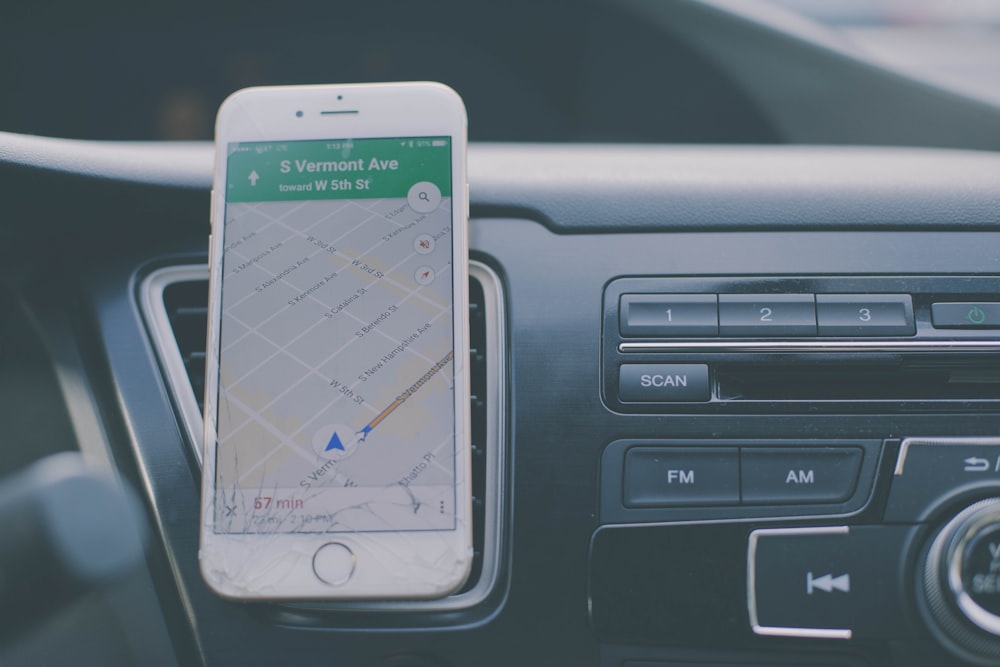 silver iPhone 6 on front of car aircon