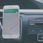 silver iPhone 6 on front of car aircon