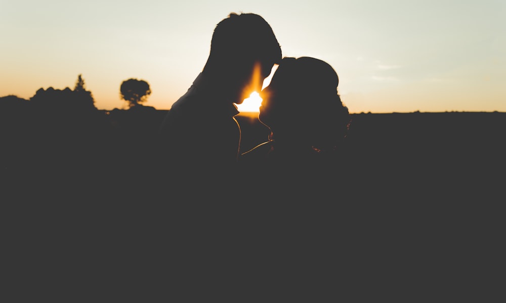 silhouette photo of man and woman