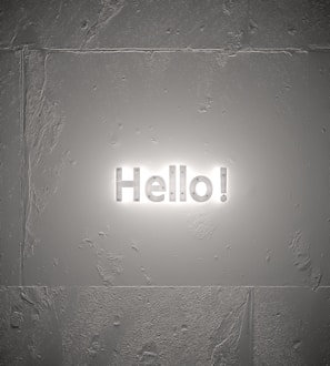 Close-up of a 5-foot Elegant Glow Sign mounted on a textured wall, showcasing the soft halo of LED light.