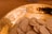 Close-up of traditional wafers arranged on a rustic wooden table with soft natural lighting.