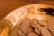 Close-up of traditional wafers arranged on a rustic wooden table with soft natural lighting.