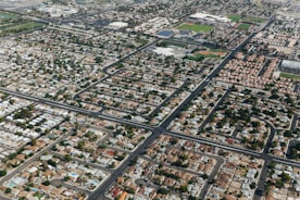 Illustration of a neighborhood with homes connected by a network symbolizing pooled home values