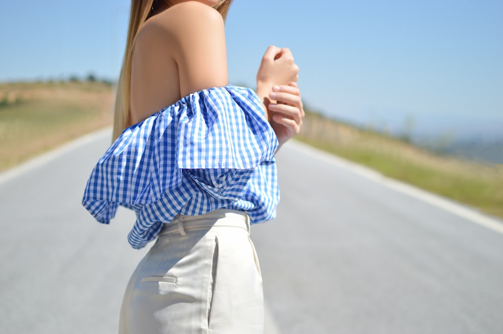 closeup photo of woman's in the middle of road