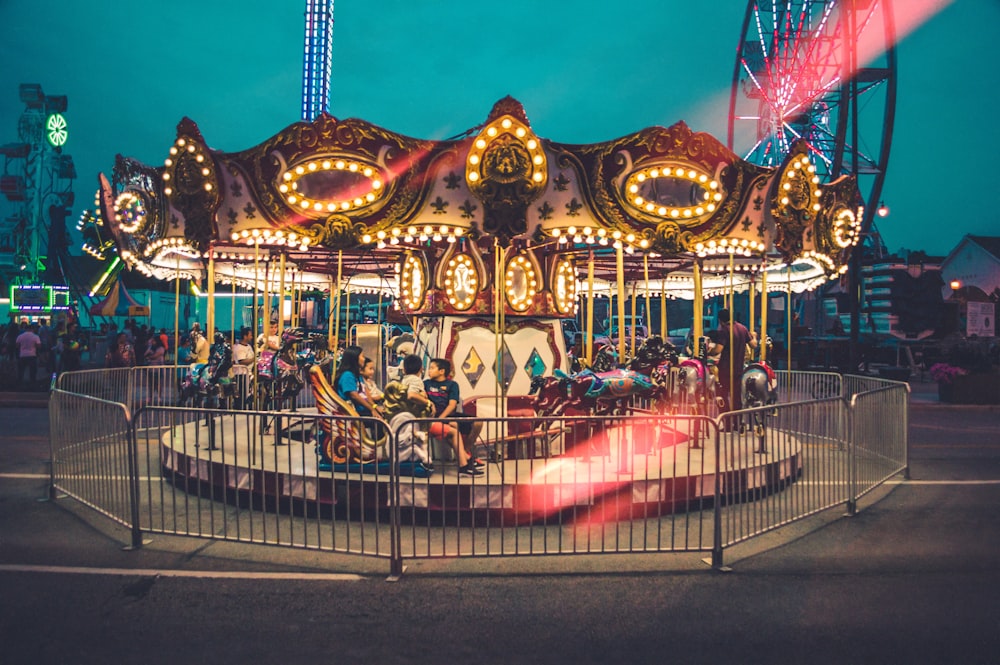 carousel in middle of theme park during nighttime