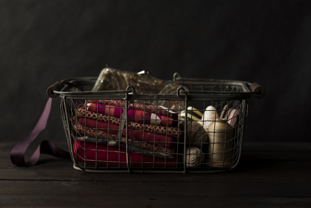 red textile on black steel basket