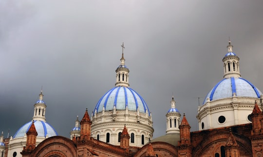 architectural photography of blue and white cathedral in New Cathedral of Cuenca Ecuador