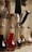 A clean kitchen countertop with various bottles of cleaning detergents arranged neatly.