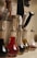 A clean kitchen countertop with various bottles of cleaning detergents arranged neatly.