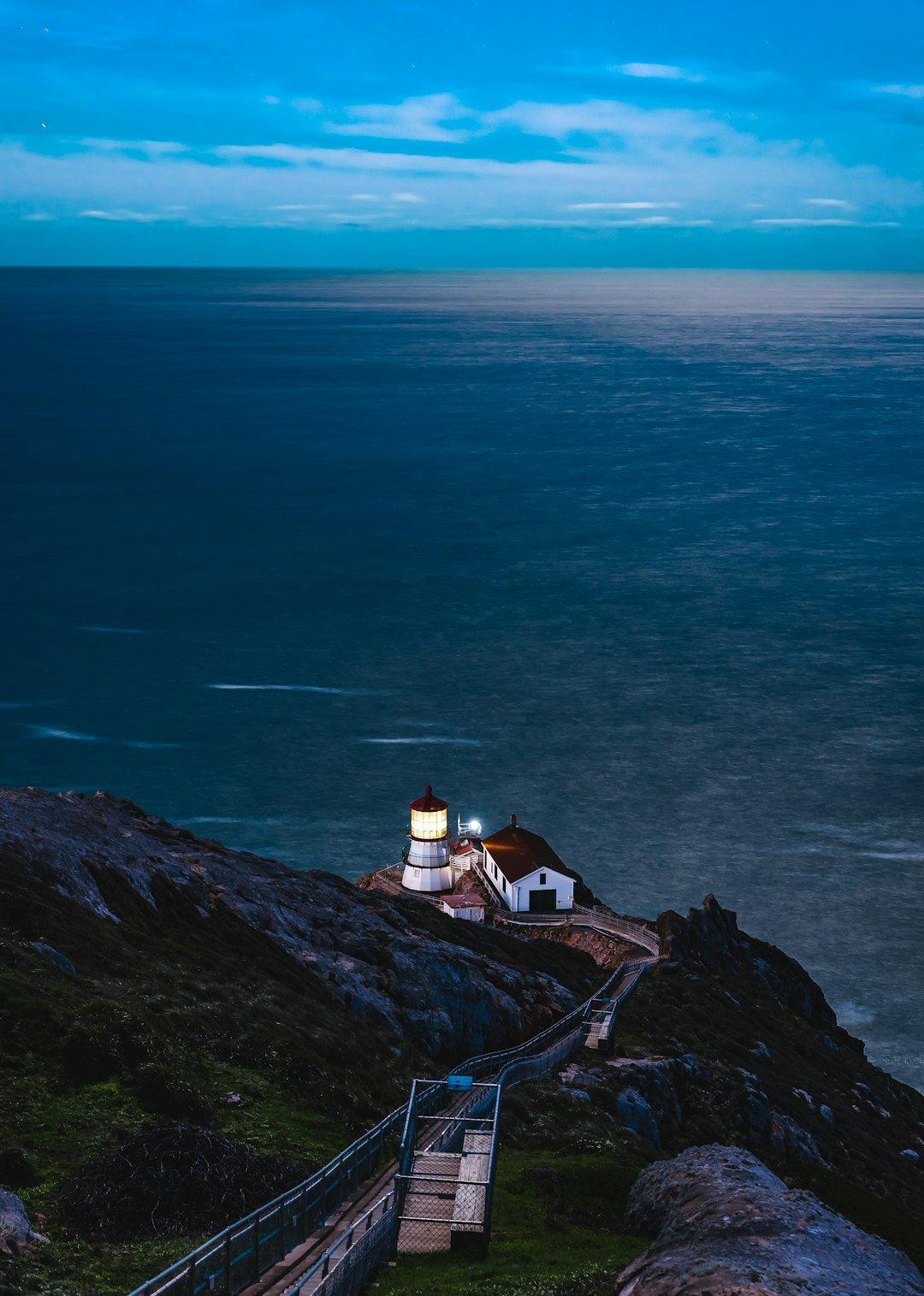 aerial view of white and tower near shore