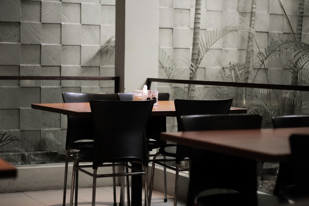 brown wooden dining table with chairs