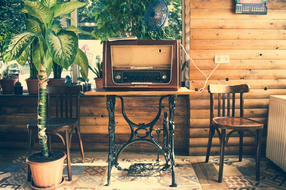 vointage brown radio on black wooden table