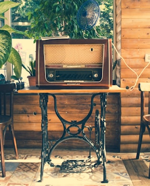 vointage brown radio on black wooden table