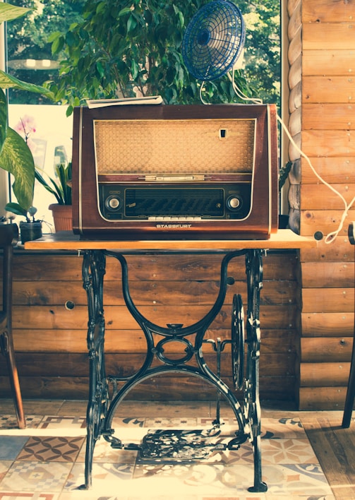 vointage brown radio on black wooden table