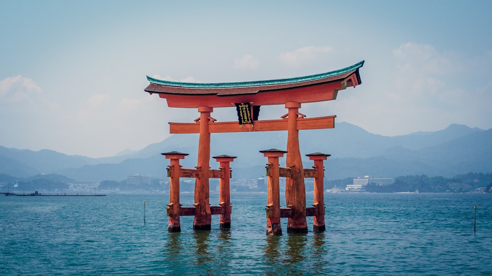 red shrine in body of water